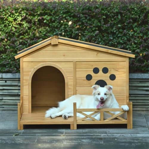 Medium wooden dog house with porch and paw print, featuring a happy dog resting outside.